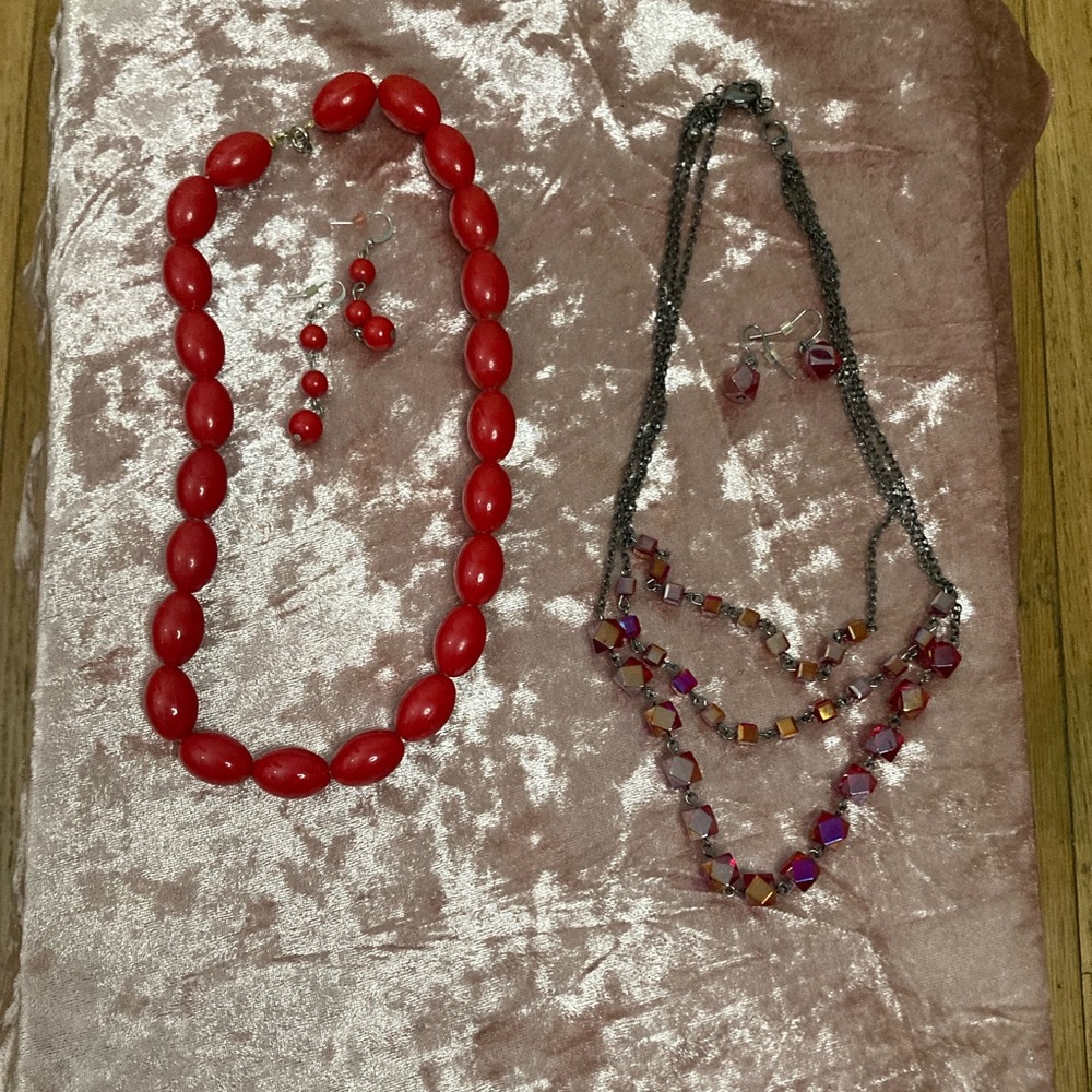 Two sets of vintage necklace and earrings. Reds and gunmetal colors! Retro fun!